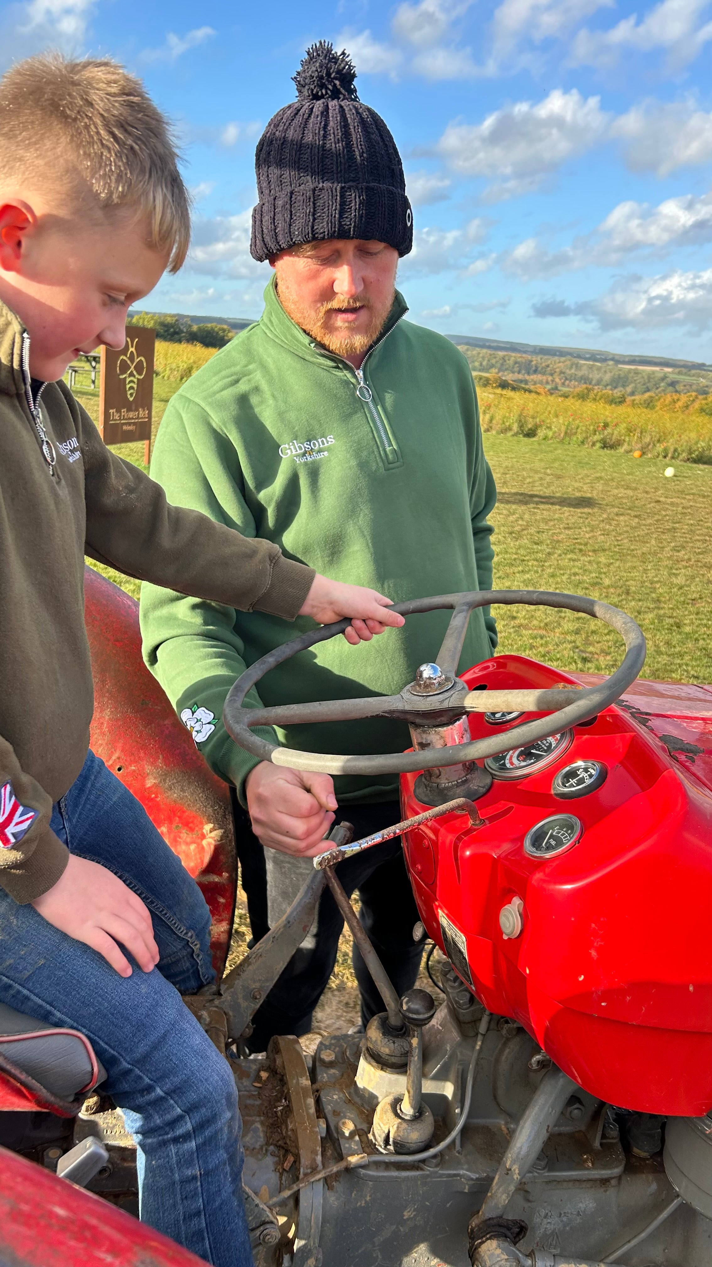 Father and son on tractor 